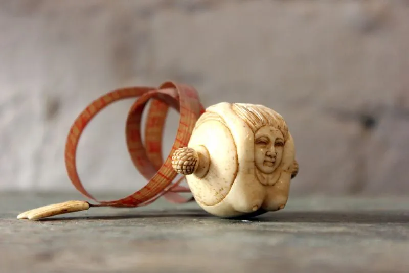 A Fine Early 20thC Carved Bone Novelty Tape Measure in the Form of a Mermaid