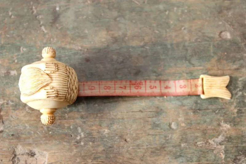 A Fine Early 20thC Carved Bone Novelty Tape Measure in the Form of a Mermaid