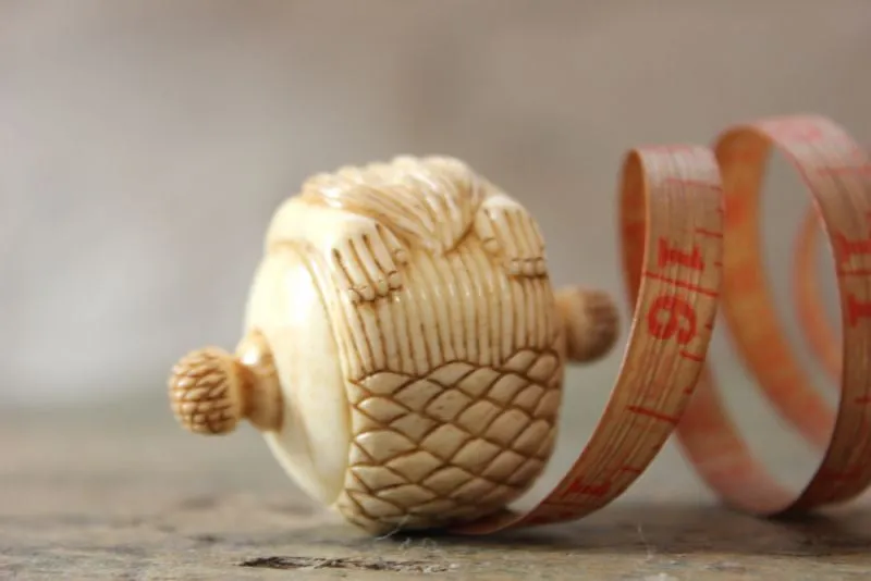 A Fine Early 20thC Carved Bone Novelty Tape Measure in the Form of a Mermaid