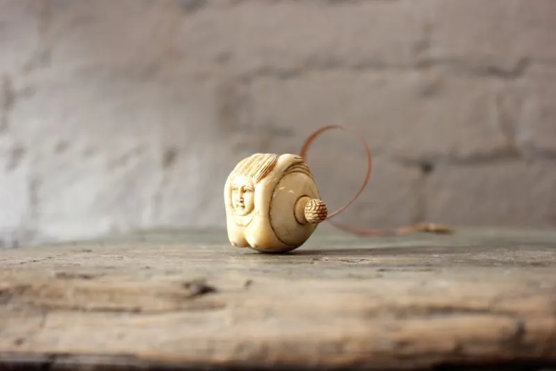 A Fine Early 20thC Carved Bone Novelty Tape Measure in the Form of a Mermaid