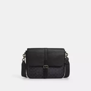 Coach Outlet Warner Messenger Bag In Signature Canvas