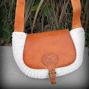 Crossbody / Shoulder bag made out of thick leather with a knitted fragment on a long leather strap