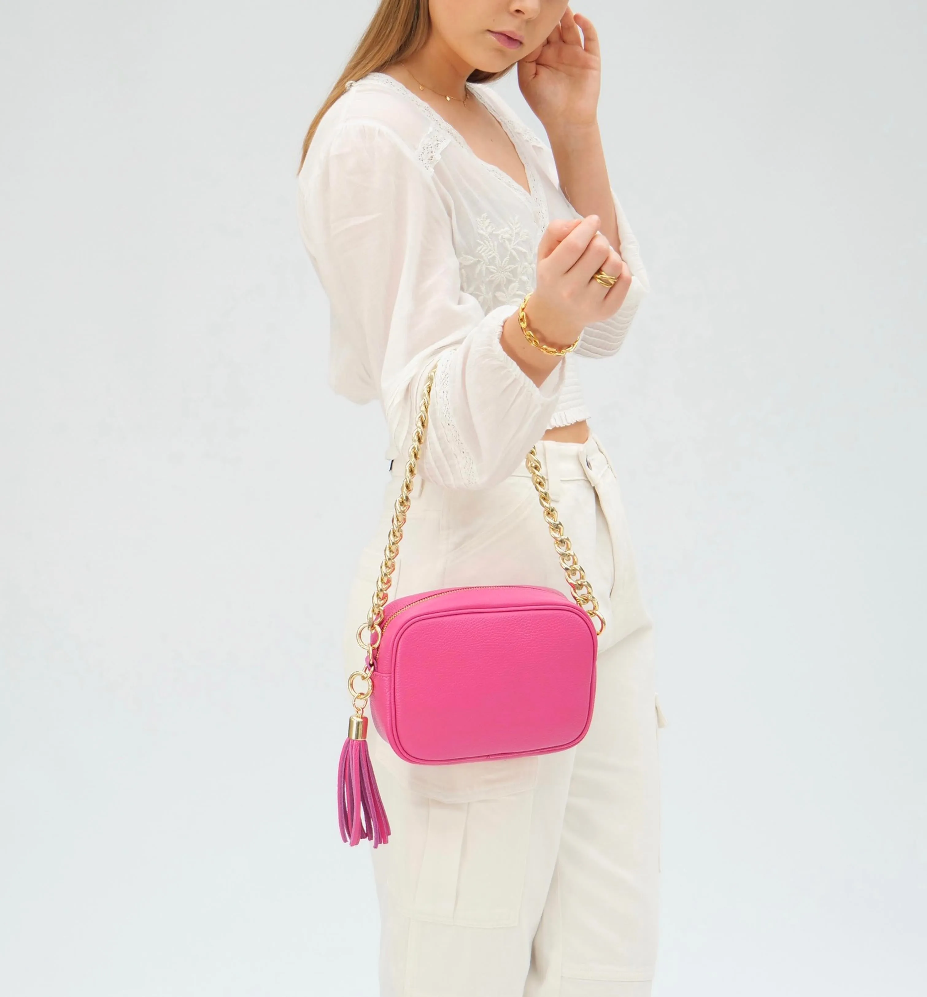 The Tassel Barbie Pink Leather Crossbody Bag With Gold Chain Strap