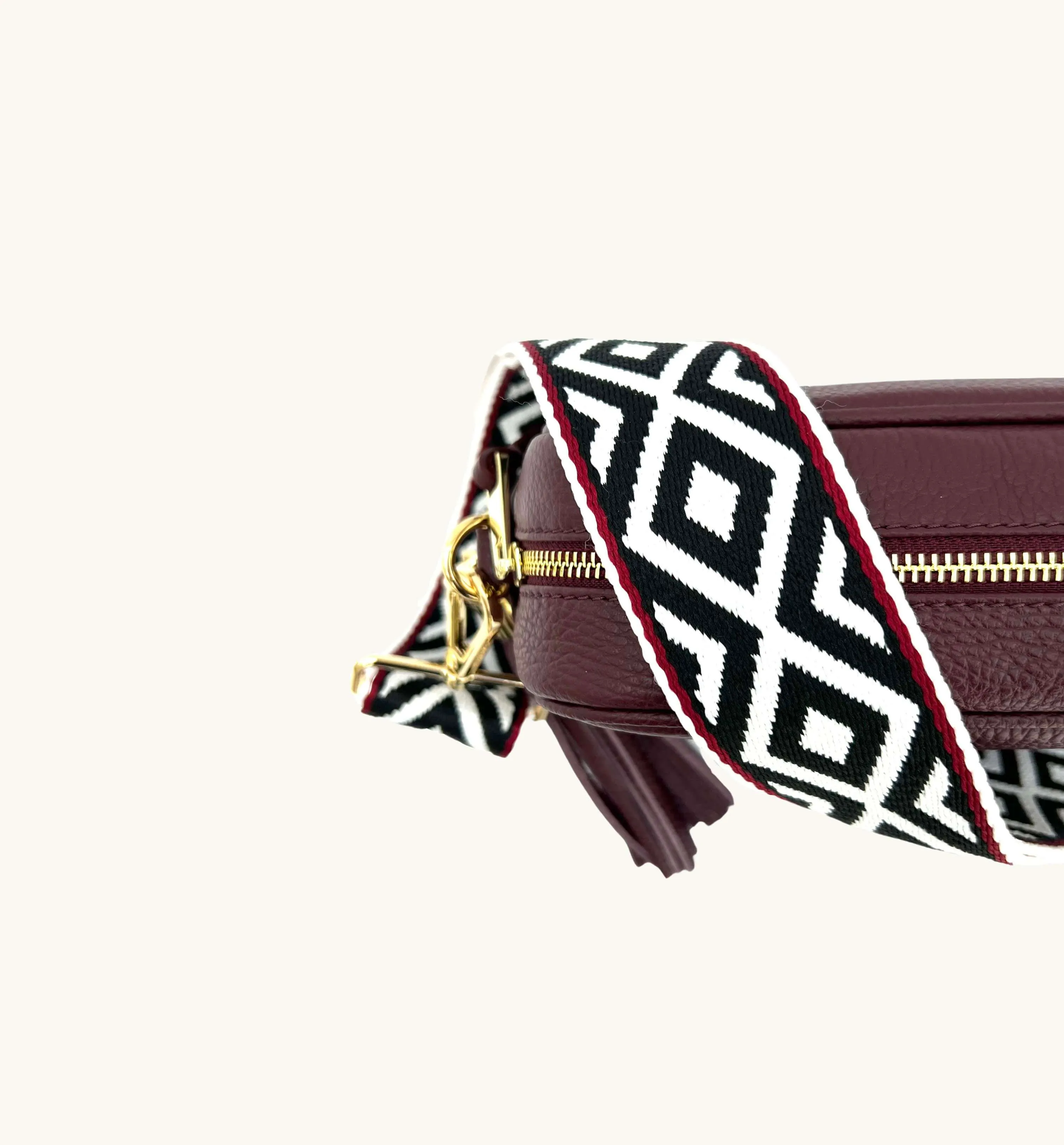 The Tassel Port Leather Crossbody Bag With Black & Red Aztec Strap